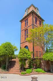 807 West Trinity Avenue, Unit 130 Durham, NC 27701 - Photo 42 of 44 a front view of a house with a yard