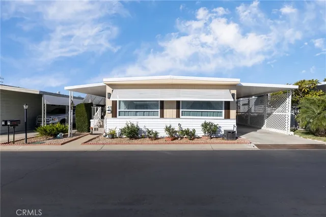 front view of a house with a garden