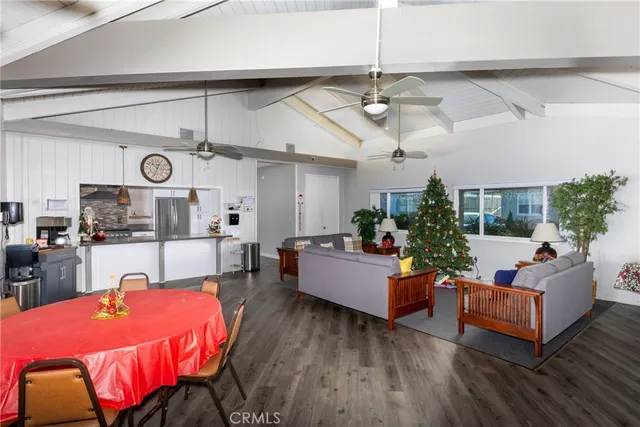 a kitchen with stainless steel appliances a refrigerator sink and microwave