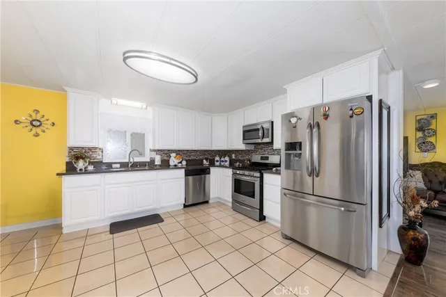 a kitchen with a sink and a stove top oven