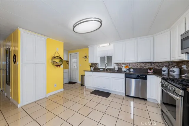 a kitchen with a sink and refrigerator
