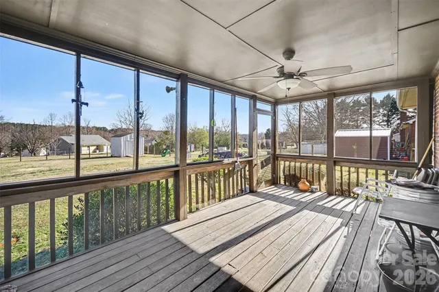a view of a balcony with wooden floor