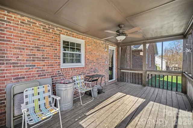a balcony with furniture and wooden floor
