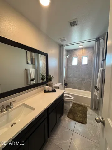 a bedroom with a bed and cabinets