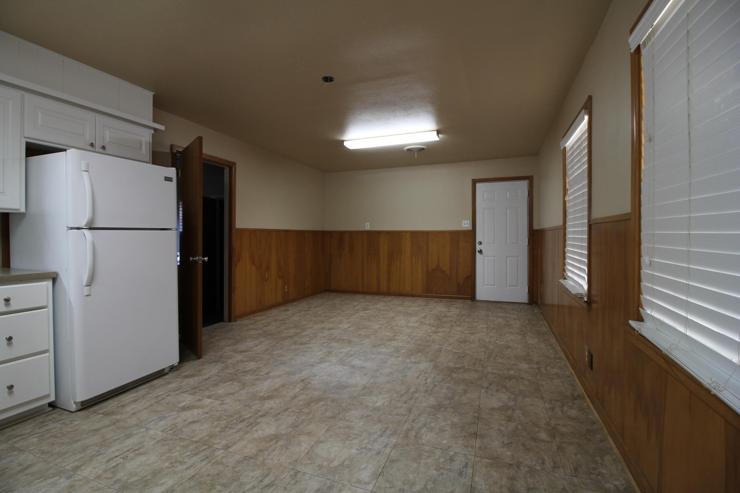 2208 32nd Street Lubbock, TX 79411 - Photo 11 of 14 a view of an empty room with closet and a window