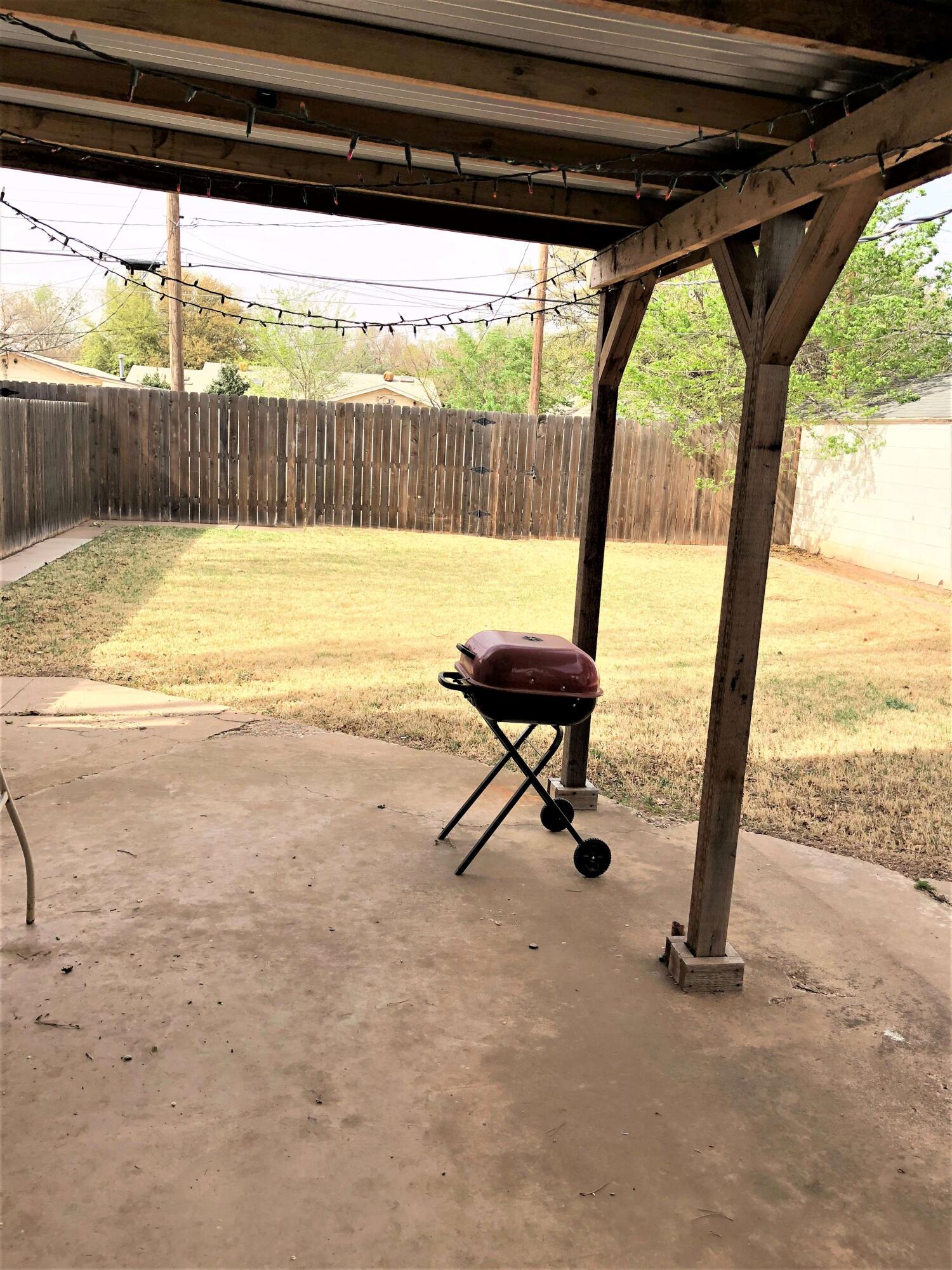 2208 32nd Street Lubbock, TX 79411 - Photo 14 of 14 a view of a floor to ceiling window and a table