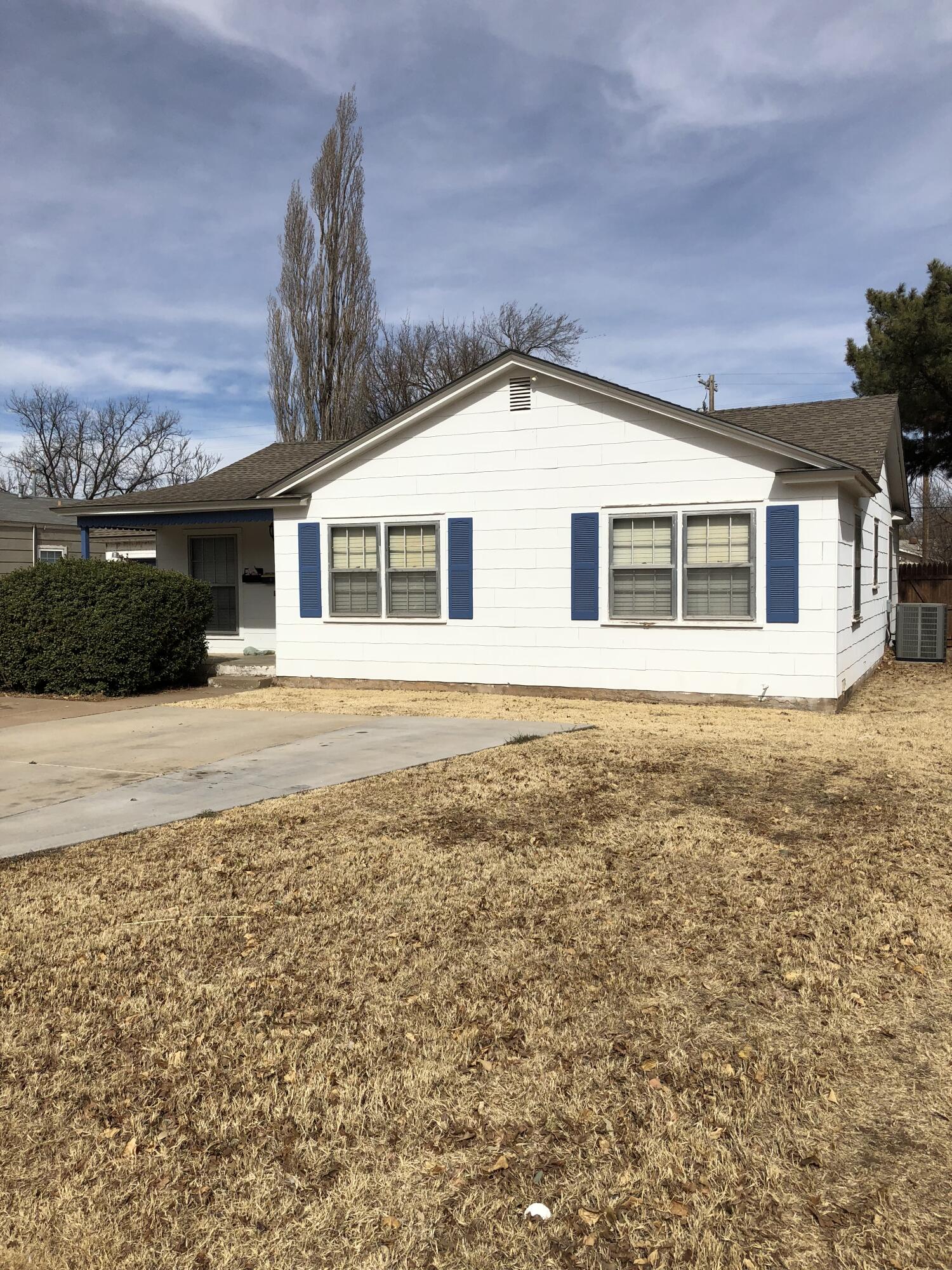 2208 32nd Street Lubbock, TX 79411 - Photo 3 of 14 a front view of a house with a yard