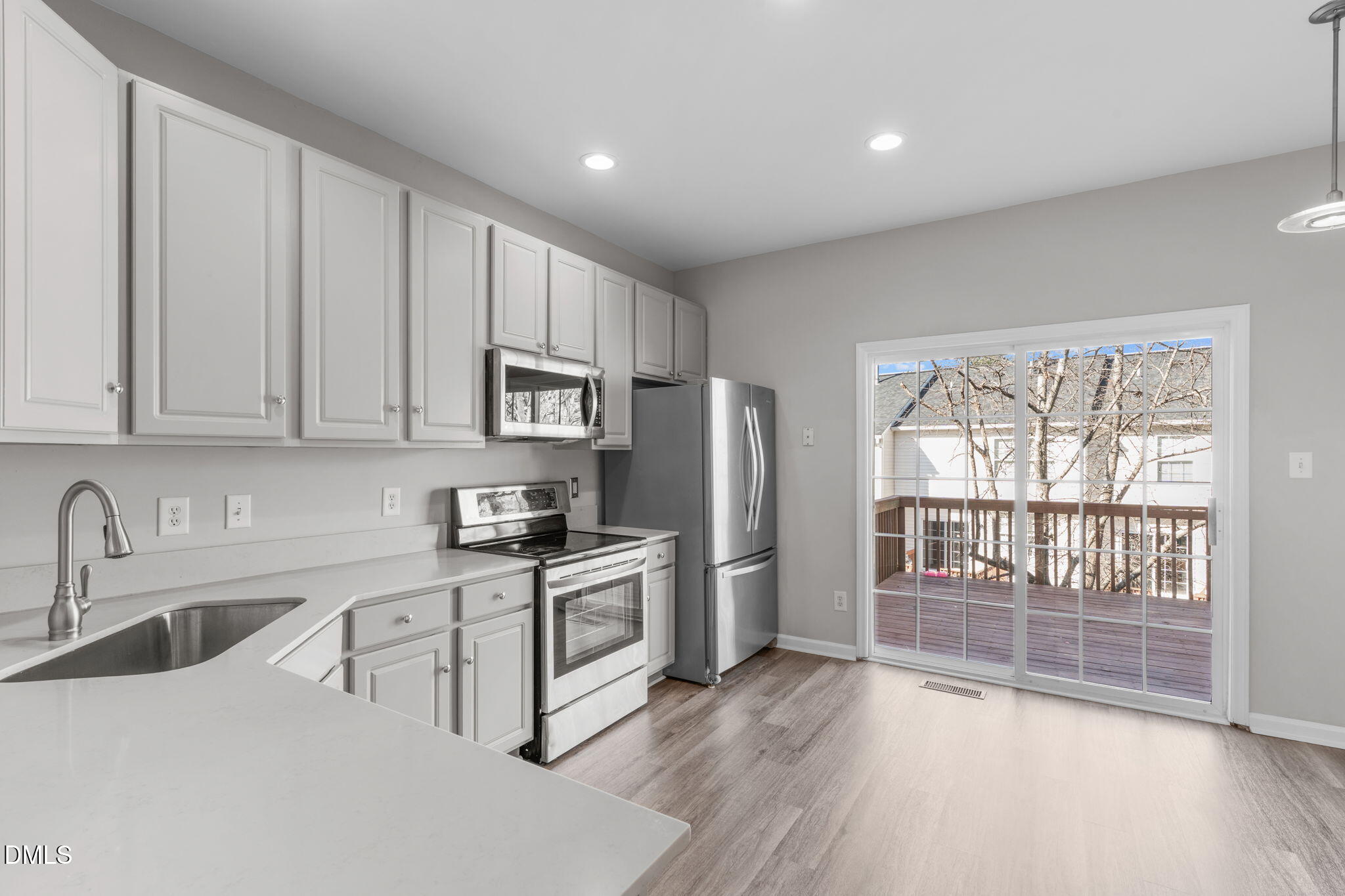 5505 Crabtree Park Court Raleigh, NC 27612 - Photo 10 of 30 a kitchen with stainless steel appliances granite countertop a refrigerator sink and stove