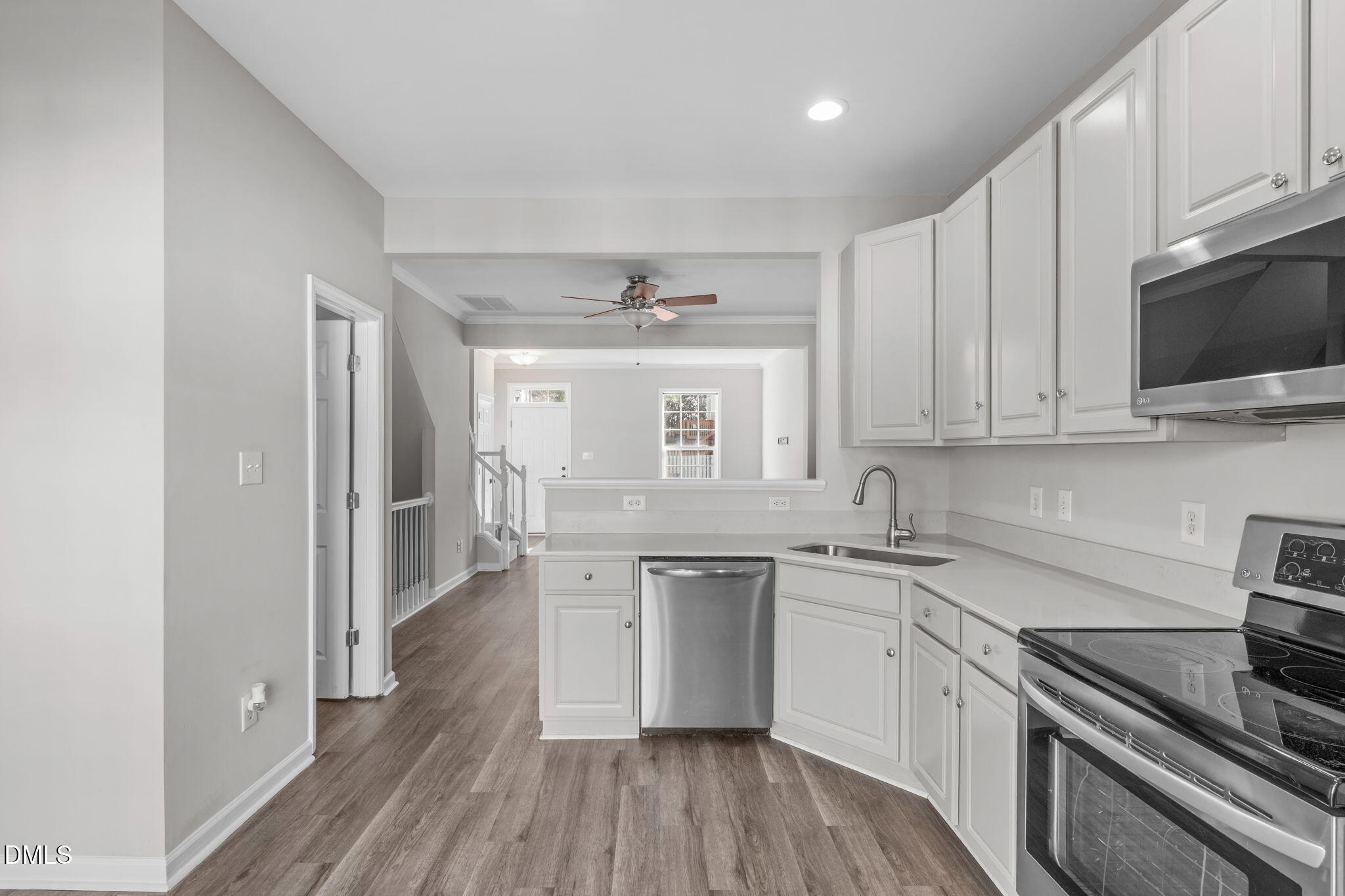5505 Crabtree Park Court Raleigh, NC 27612 - Photo 12 of 30 a kitchen with stainless steel appliances granite countertop a stove and a sink