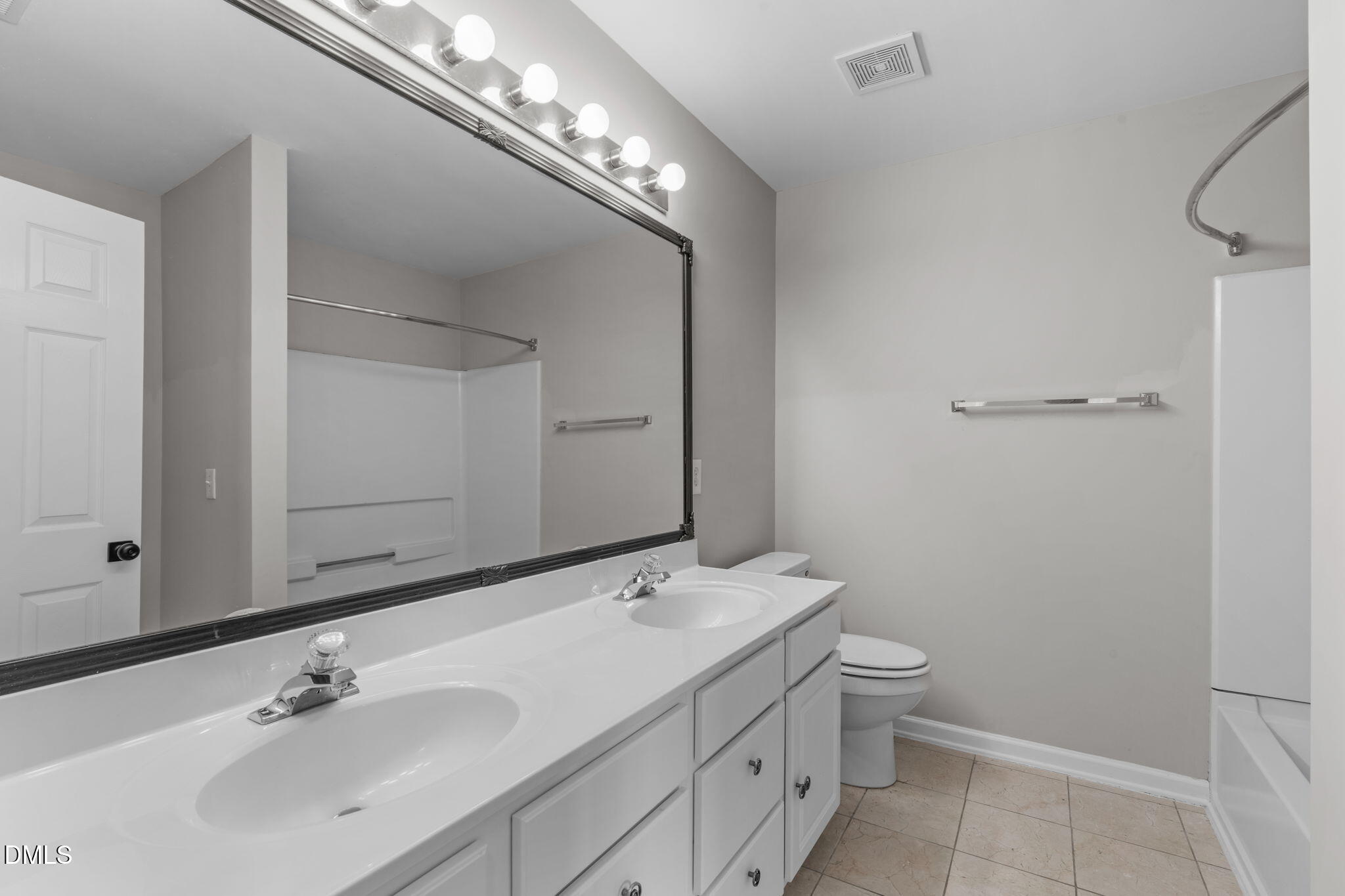 5505 Crabtree Park Court Raleigh, NC 27612 - Photo 16 of 30 a bathroom with a toilet sink and mirror