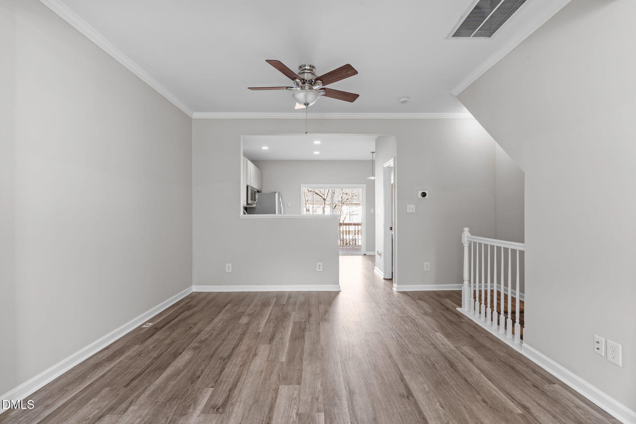 5505 Crabtree Park Court Raleigh, NC 27612 - Photo 7 of 30 wooden floor in an empty room with a window