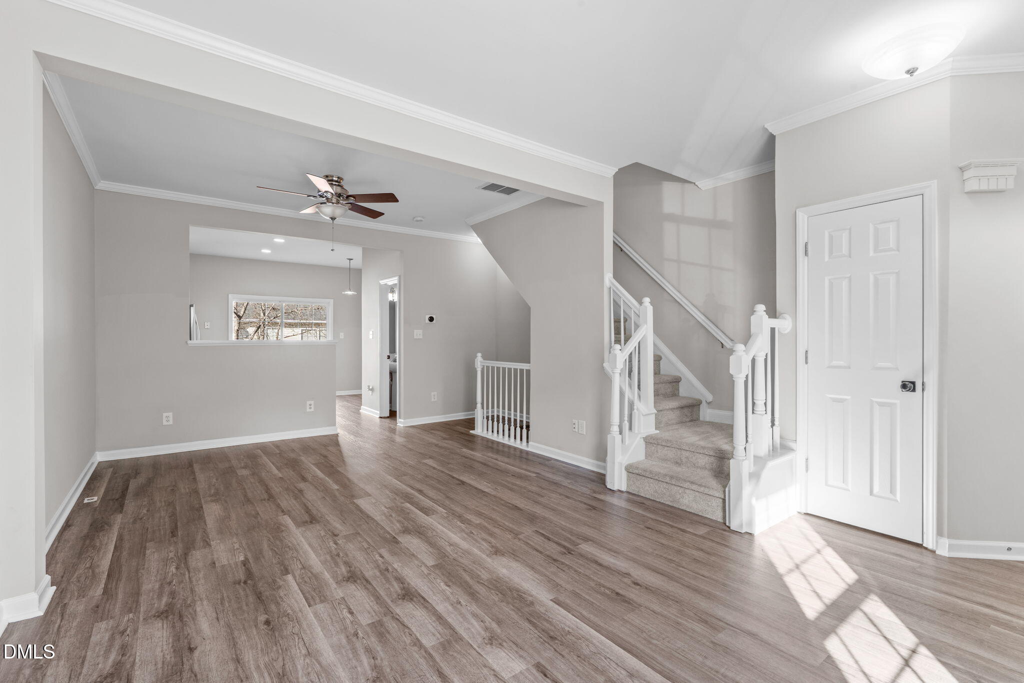 5505 Crabtree Park Court Raleigh, NC 27612 - Photo 8 of 30 a view of a room with wooden floor and staircase