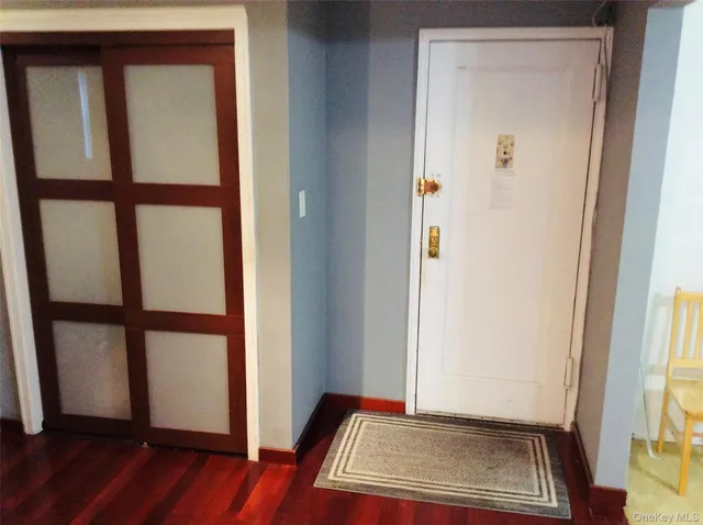 a view of front door with wooden floor