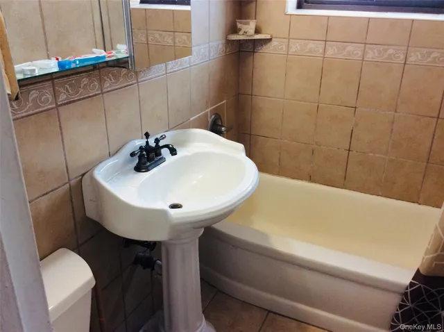 a bathroom with a sink and mirror
