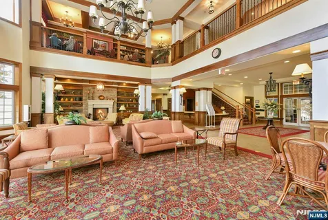 a balcony with furniture and view of city