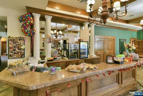 a kitchen with a stove and a refrigerator