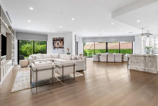 a view of white cabinets and wooden floor