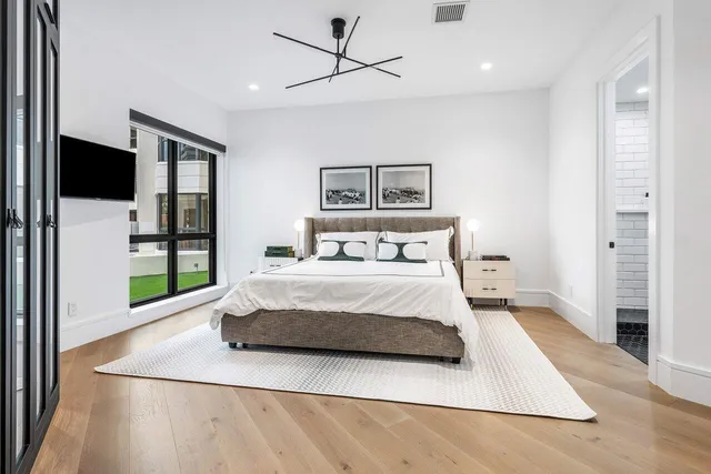 a bathroom with a sink a mirror and a shower