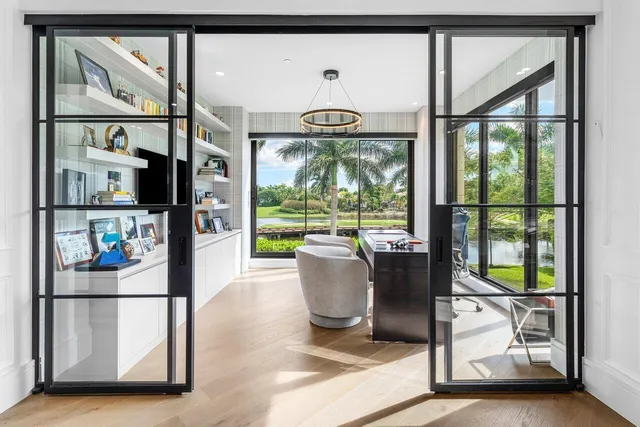 a outdoor space with patio couch and a floor to ceiling window