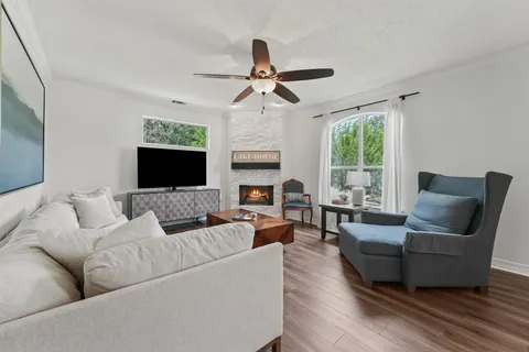 a living room with furniture and a fireplace