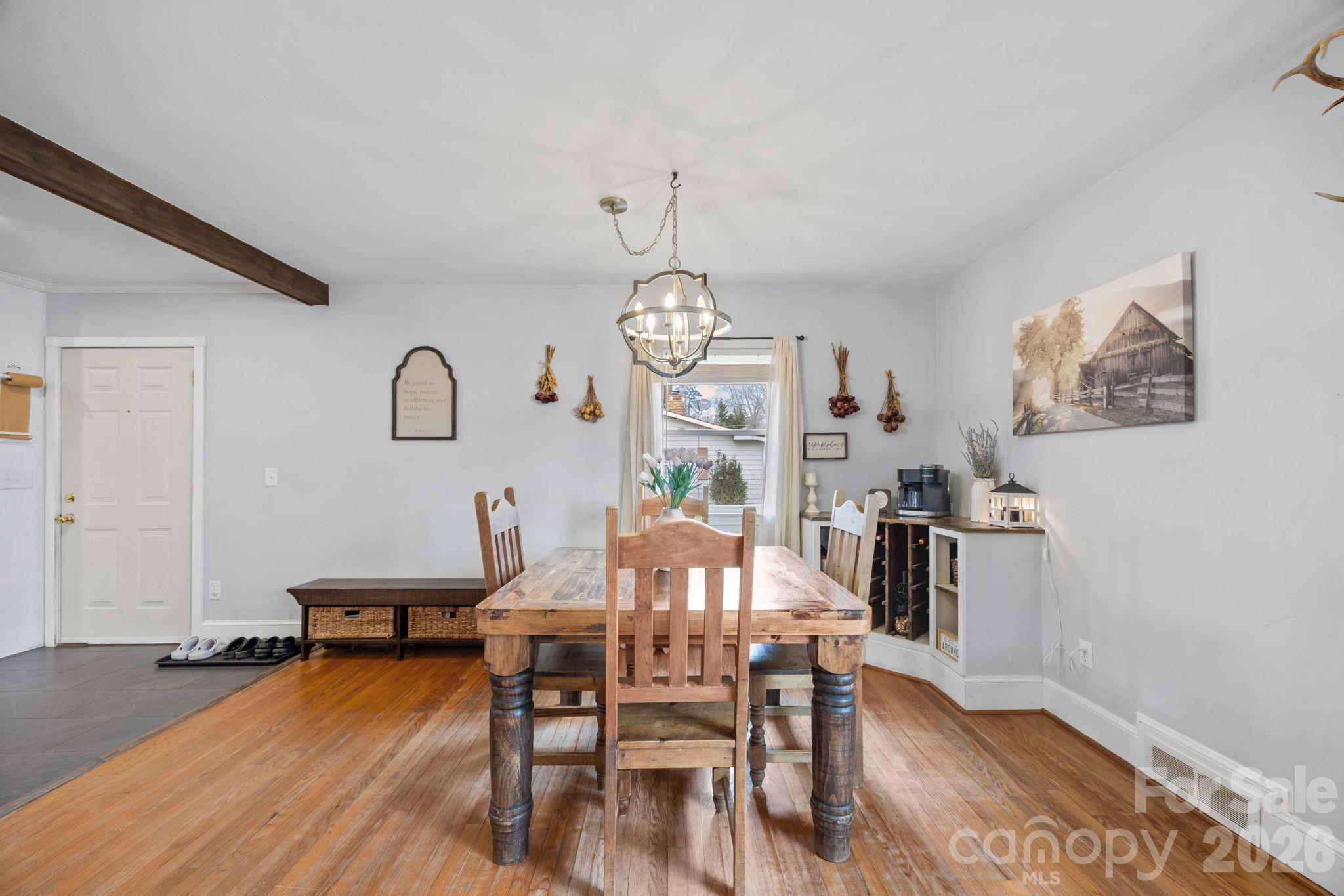 275 Tanner Street Rutherfordton, NC 28139 - Photo 20 of 44 a view of a dining room with furniture a chandelier and wooden floor