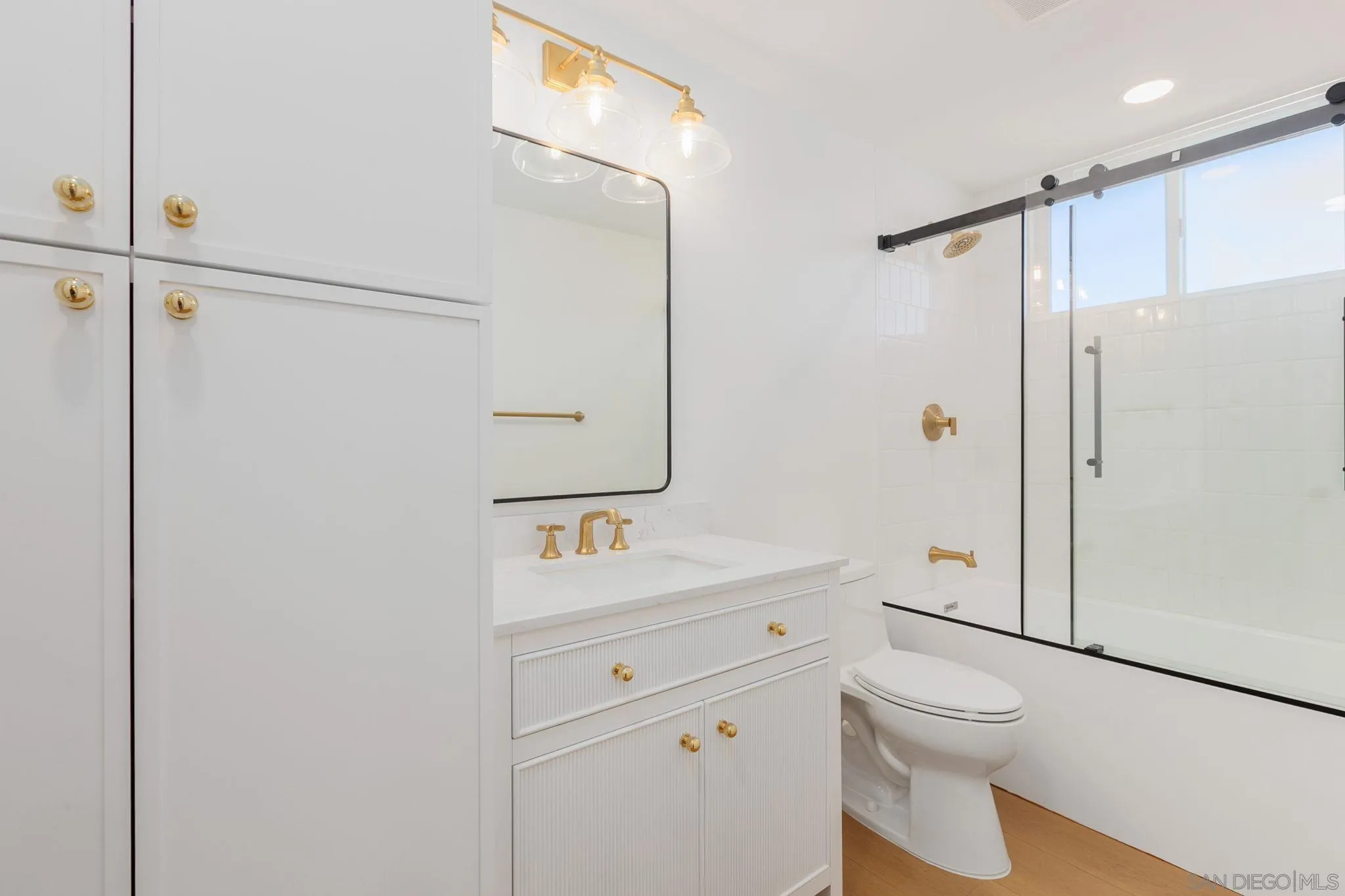 210 A Street, Unit 11 Encinitas, CA 92024 - Photo 11 of 49 a bathroom with a sink a toilet and shower