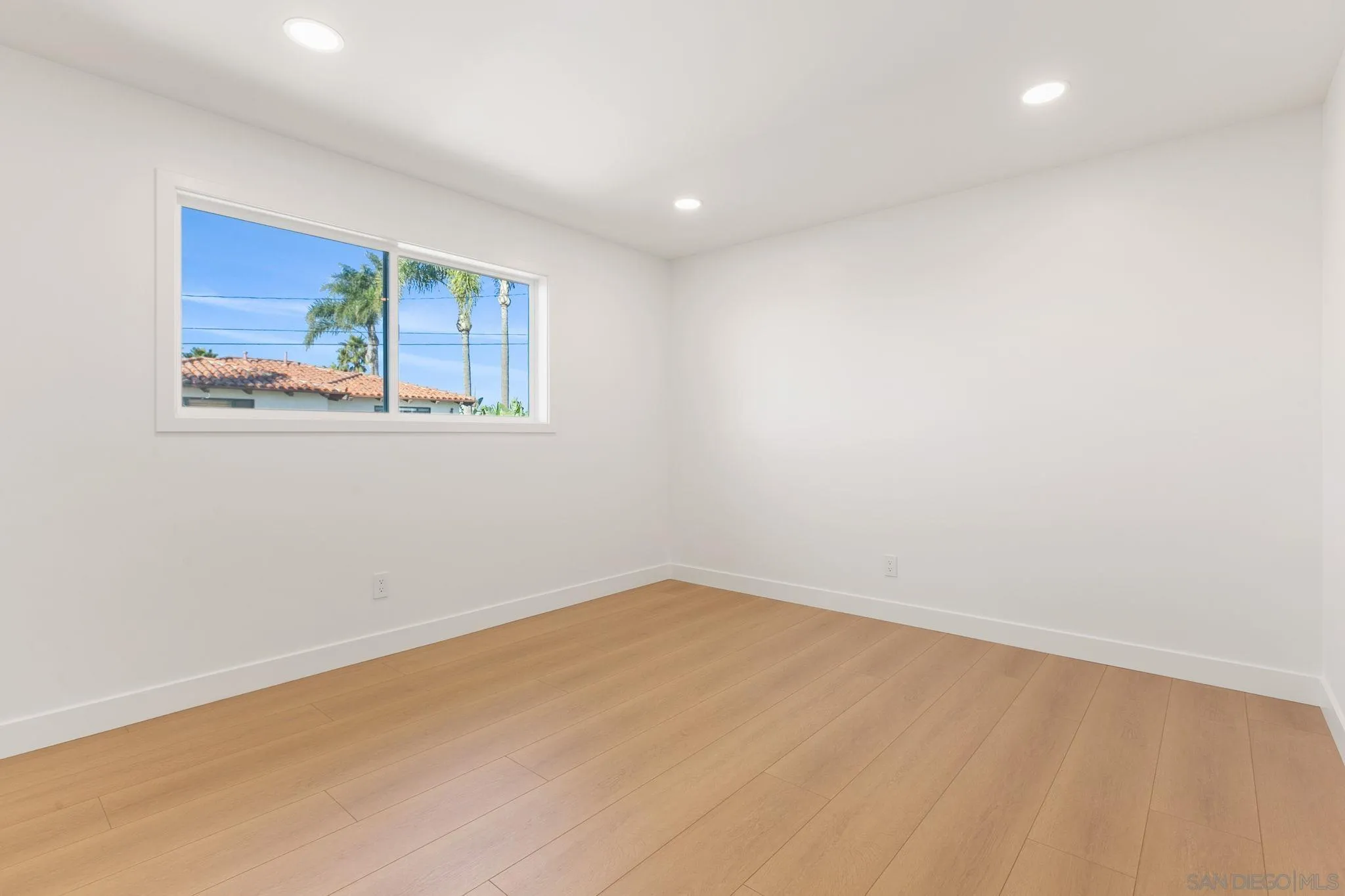 210 A Street, Unit 11 Encinitas, CA 92024 - Photo 12 of 49 an empty room with a window