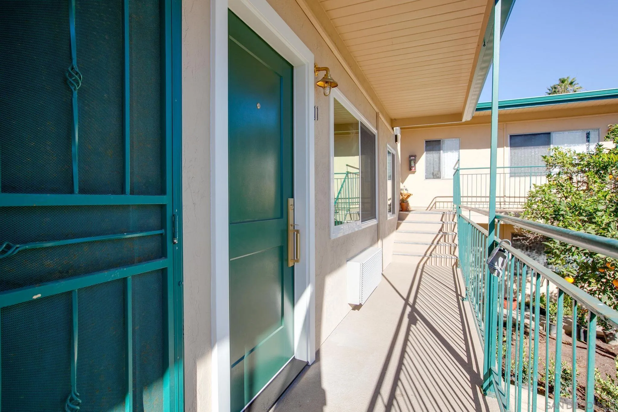 210 A Street, Unit 11 Encinitas, CA 92024 - Photo 17 of 49 a view of an entryway with wooden floor and windows
