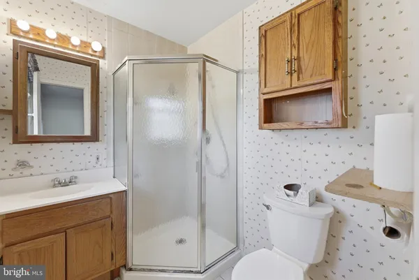 a view of a room with wooden floor and closet