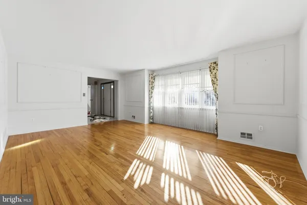 a view of wooden floor in an empty room