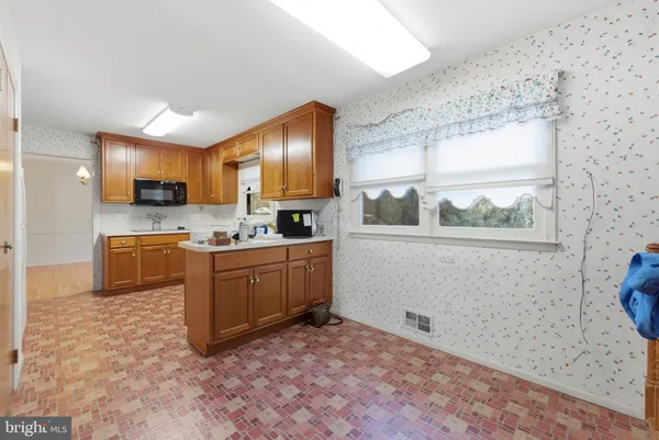 a kitchen with sink cabinets and appliances