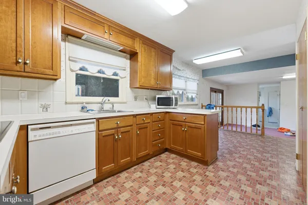 a kitchen with a sink and a window