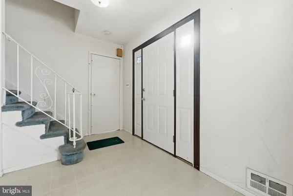 a view of a room with windows and ceiling fan