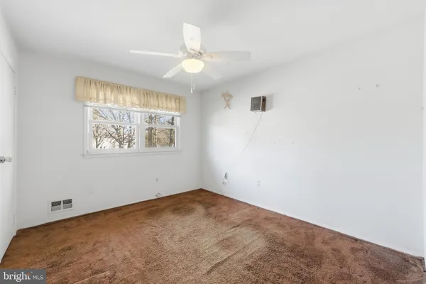 a view of a big room with carpet