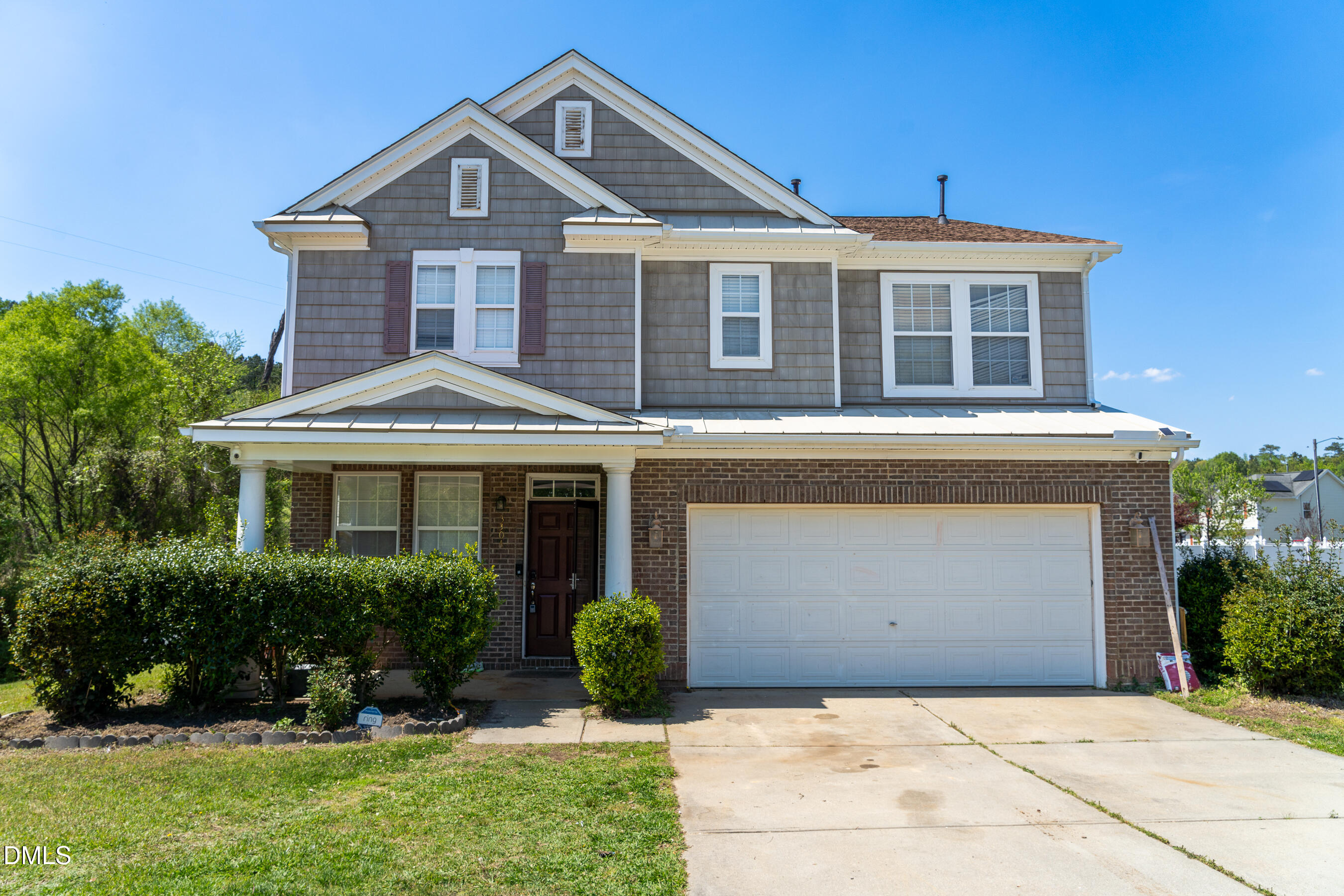 3304 Mackinac Island Lane Raleigh, NC 27610 - Photo 1 of 30 a front view of a house with a yard and garage