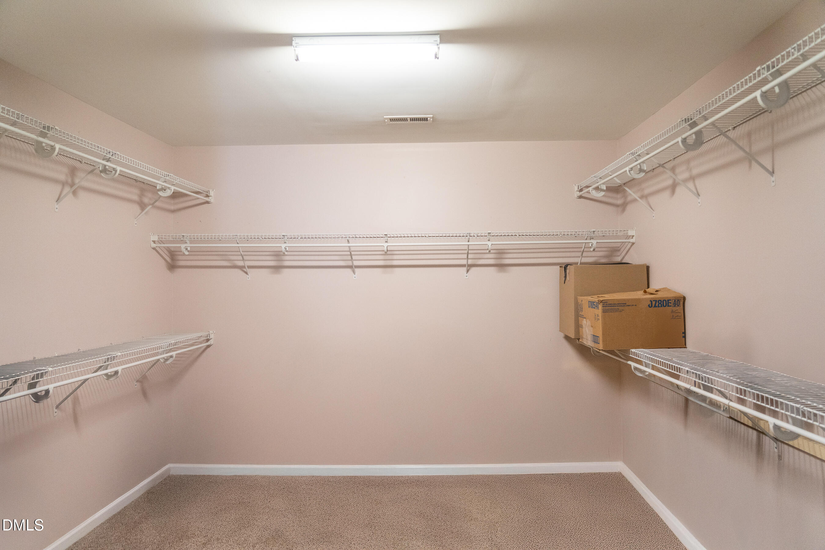 3304 Mackinac Island Lane Raleigh, NC 27610 - Photo 19 of 30 a view of small space with racks on the wall