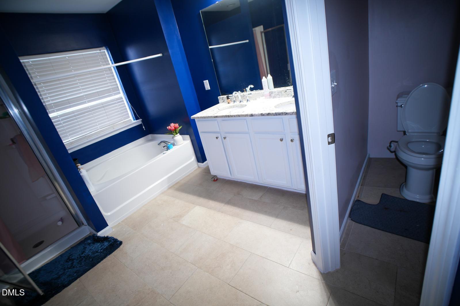 3304 Mackinac Island Lane Raleigh, NC 27610 - Photo 22 of 30 a bathroom with a sink and toilet