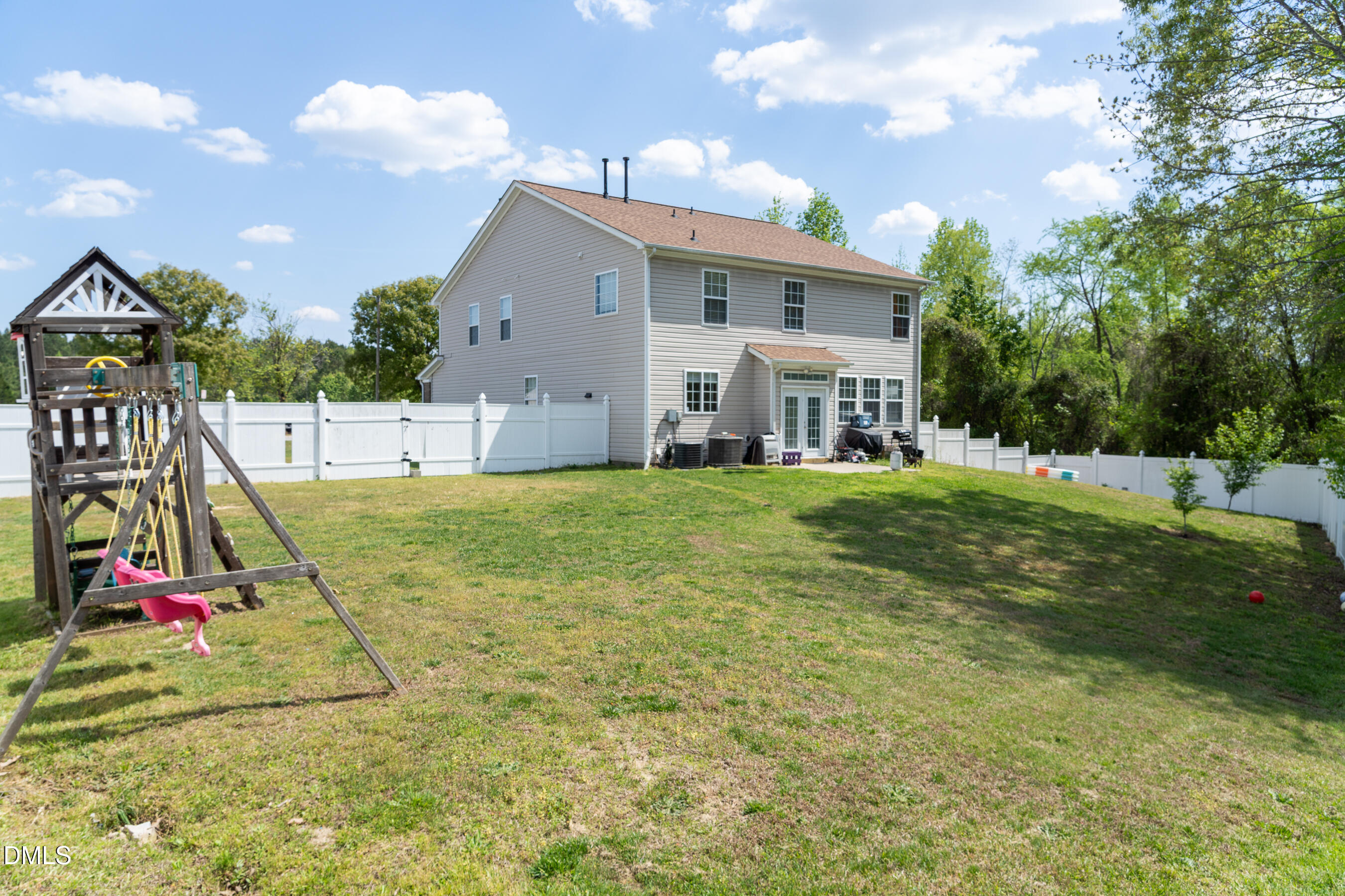 3304 Mackinac Island Lane Raleigh, NC 27610 - Photo 26 of 30 a view of a house with swimming pool and a yard