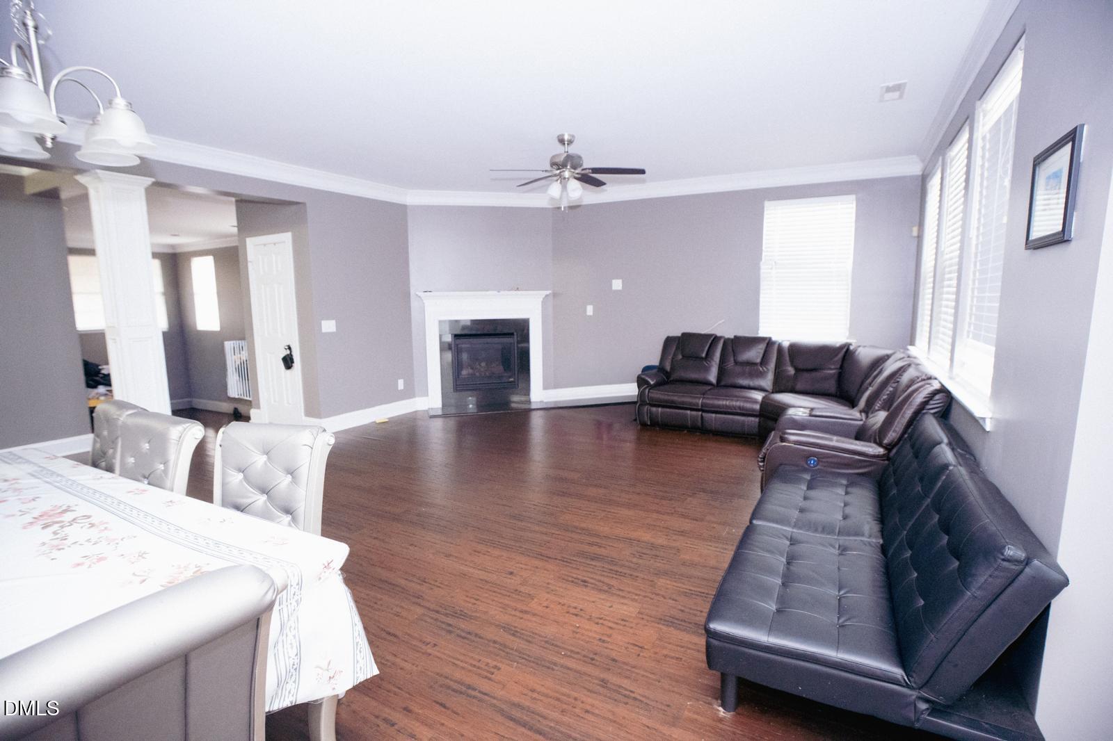 3304 Mackinac Island Lane Raleigh, NC 27610 - Photo 6 of 30 a living room with furniture and a fireplace