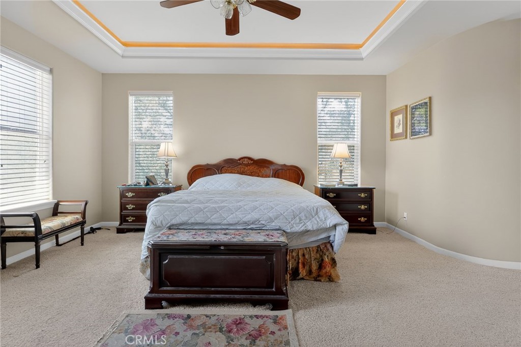 19370 Park Ridge Drive Hidden Valley Lake, CA 95467 - Photo 18 of 61 a bedroom with a bed and a dresser next to a window