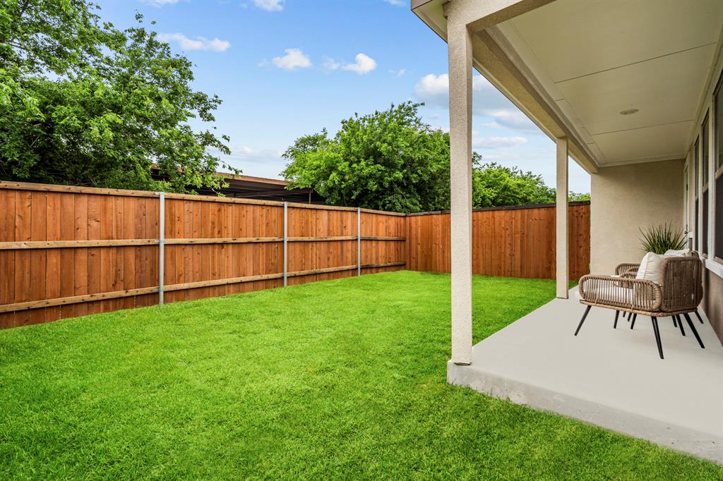 3278 Ganzer Road West, Unit 215B Denton, TX 76207 - Photo 32 of 32 a view of backyard with a garden and seating