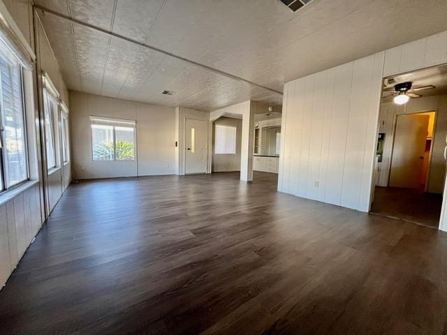 1500 Villa Avenue, Unit 23 Clovis, CA 93612 - Photo 14 of 33 an empty room with wooden floor and windows