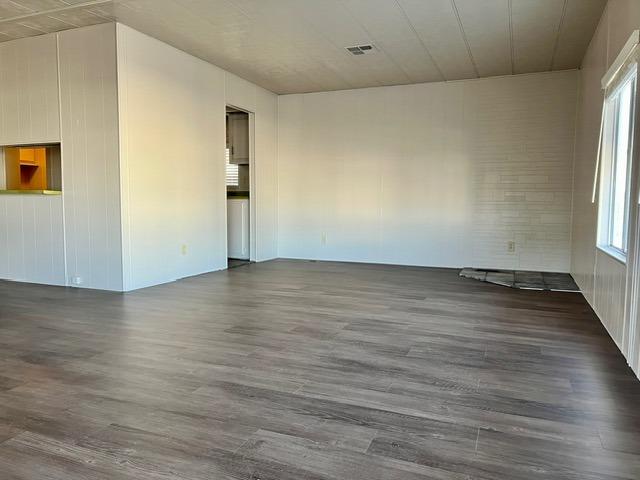 1500 Villa Avenue, Unit 23 Clovis, CA 93612 - Photo 15 of 33 an empty room with wooden floor and windows