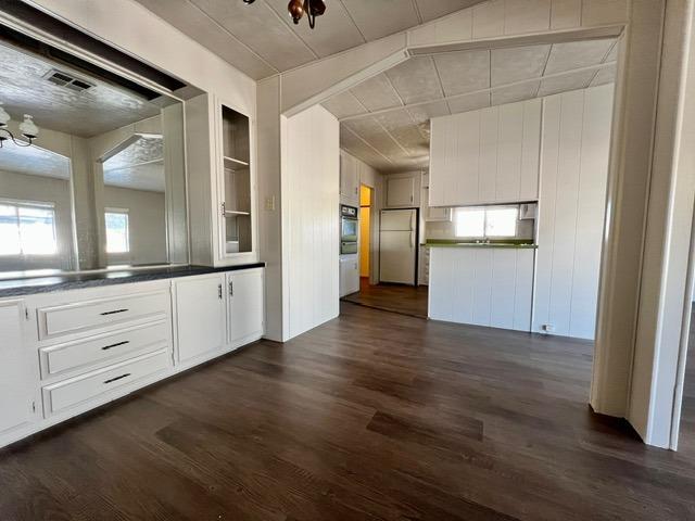 1500 Villa Avenue, Unit 23 Clovis, CA 93612 - Photo 17 of 33 a view of a kitchen with a dishwasher and wooden floor