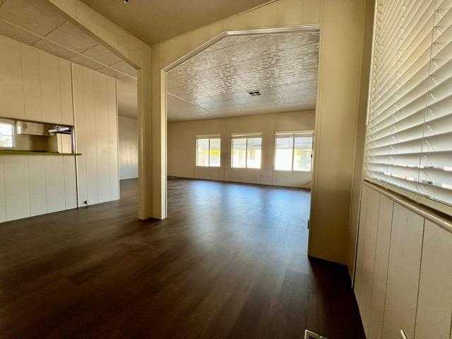 1500 Villa Avenue, Unit 23 Clovis, CA 93612 - Photo 19 of 33 a view of an empty room with wooden floor and a window