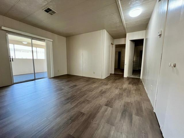 1500 Villa Avenue, Unit 23 Clovis, CA 93612 - Photo 23 of 33 an empty room with wooden floor and windows