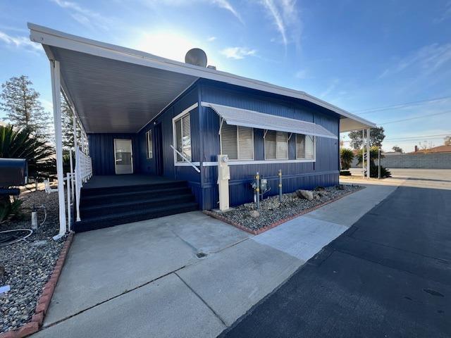 1500 Villa Avenue, Unit 23 Clovis, CA 93612 - Photo 3 of 33 a front view of a house with a yard