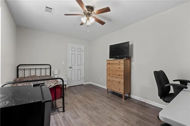 a view of a livingroom with furniture and a flat screen tv