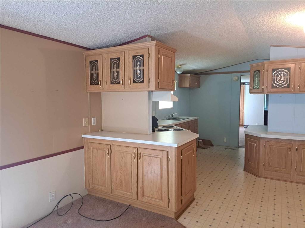 44 Adams Street McDonald, PA 15057 - Photo 9 of 30 a kitchen with cabinets and wooden floor