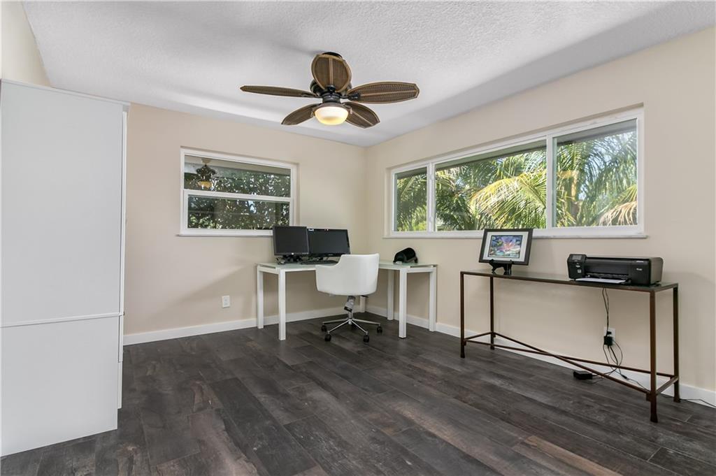 132 South Sewalls Point Road Stuart, FL 34996 - Photo 20 of 31 a view of a livingroom with workspace and a window